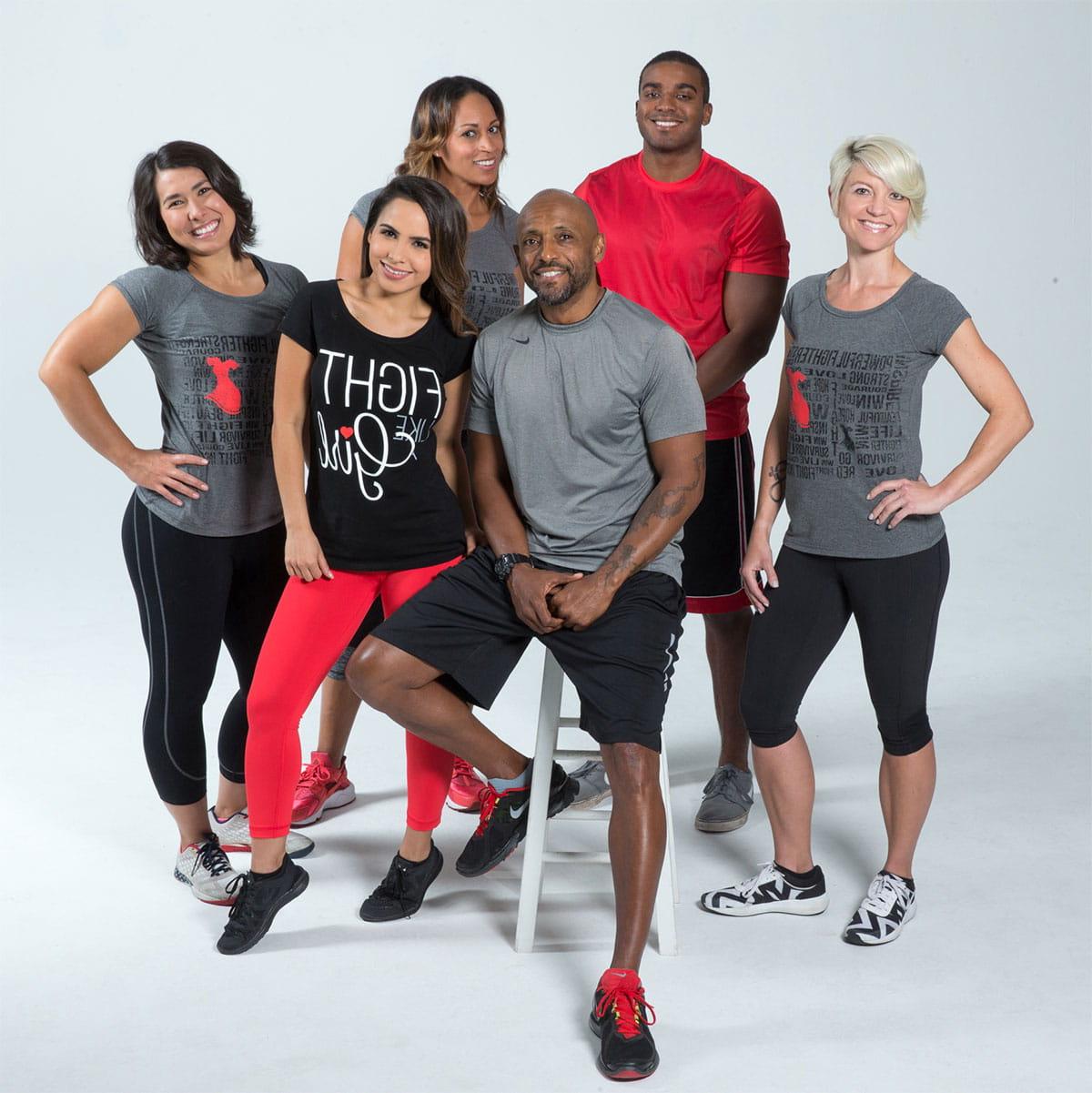 Group portrait of diverse adults in athletic attire