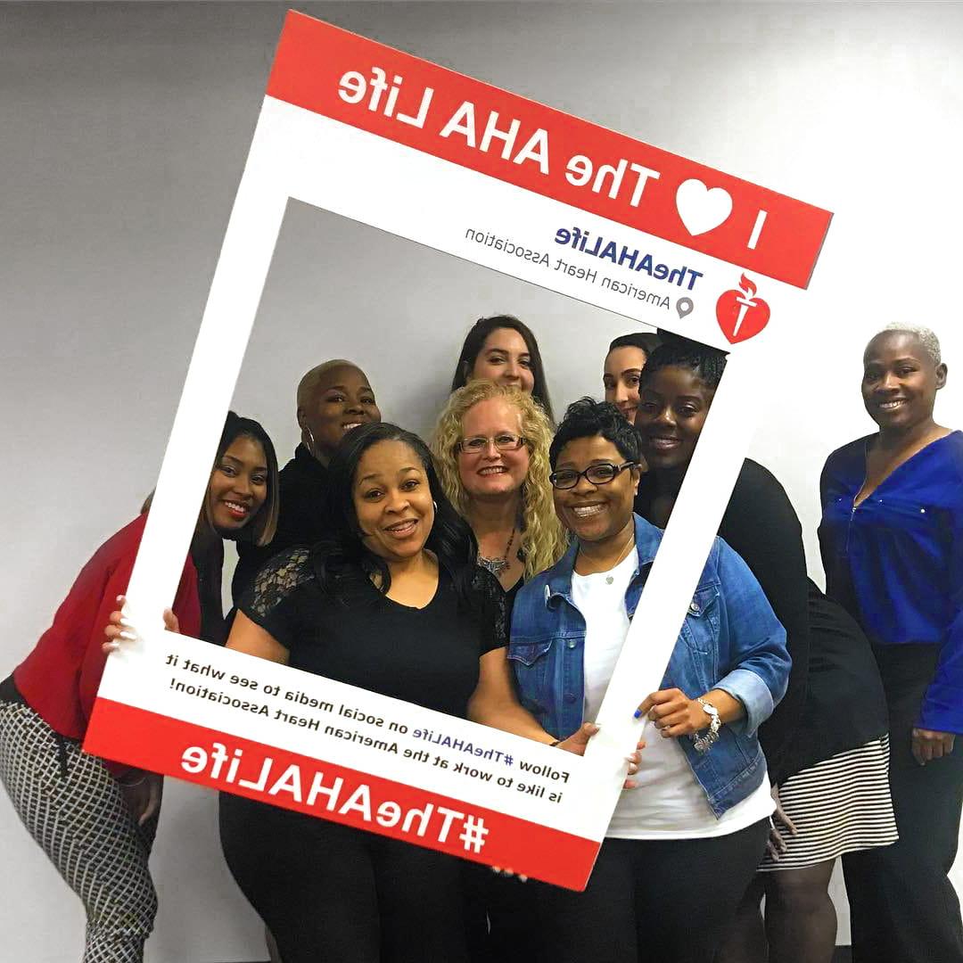 Group of AHA employees posing for social media photo