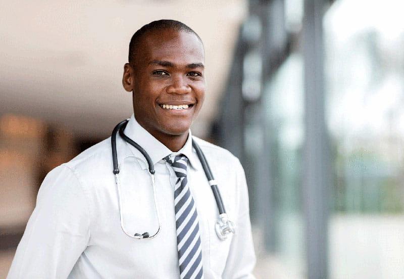 smiling young doctor wearing stethoscope